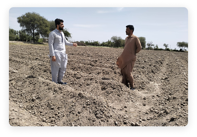 Savak field team with a Community 1 farmer